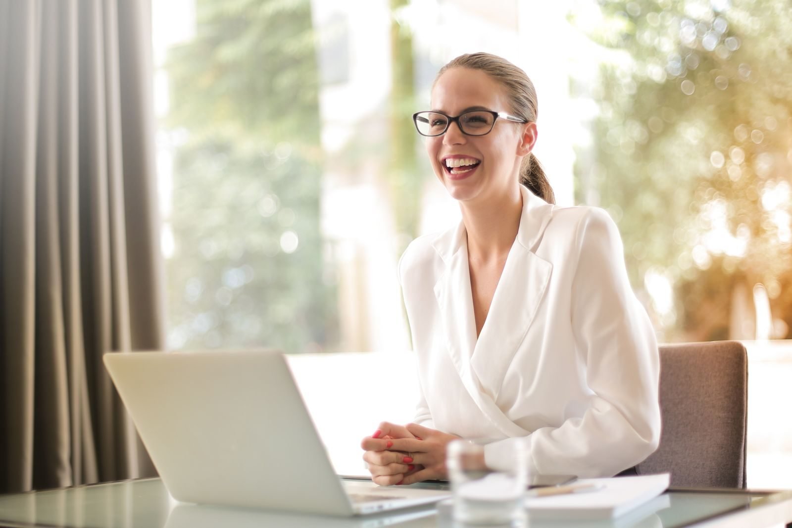 Woman taking notes at a desk